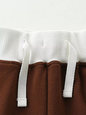 Brown cotton baby shorts with white drawstring waistband detail