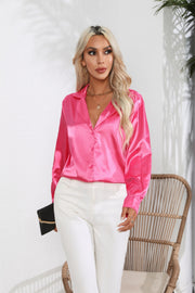 Hot pink glossy satin button-down blouse with a collared neckline and long sleeves.