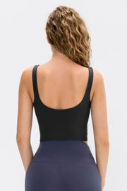 Black performance scoop crop top with wide straps, shown from the back.