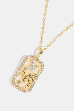 14K gold-plated Taurus zodiac sign crystal pendant necklace with turquoise accents.