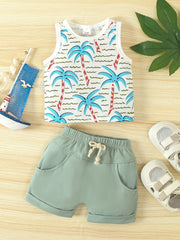 Baby tank top and shorts set in light green with tropical palm print on top.