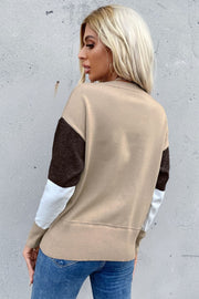 Geometric panel knit sweater in coffee, tan, white, and brown with ribbed cuffs and hem.
