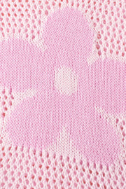 Openwork floral intarsia sweater in blush pink acrylic with a delicate open knit detail.