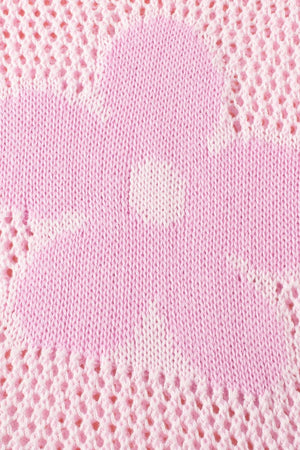 Openwork floral intarsia sweater in blush pink acrylic with a delicate open knit detail.