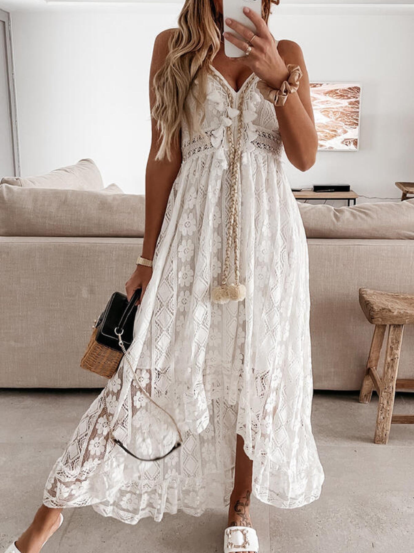 White lace V-neck maxi dress with ruffles and tassel detail