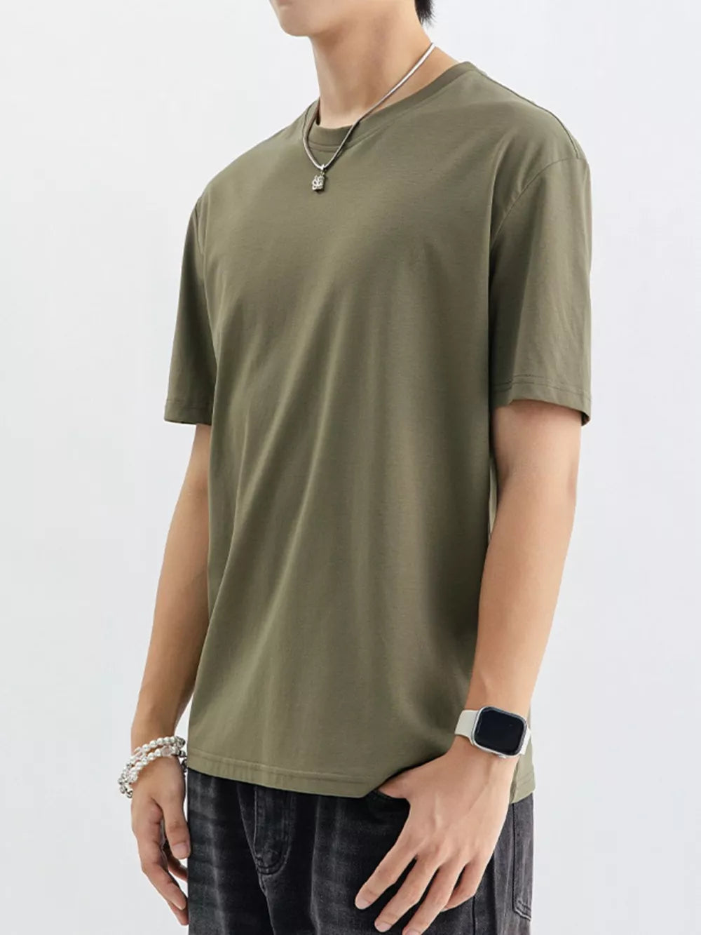 Men's green cotton crewneck t-shirt with short sleeves.
