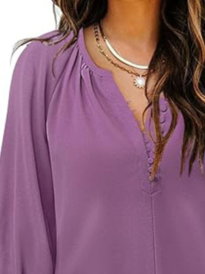 Lilac blouse with notched V-neck, 3/4 sleeves, and button-down detail.