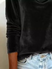 Black velvet cowl neck t-shirt with long sleeves, styled with jeans.