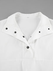 White two-piece set with snap details and a collared neckline.