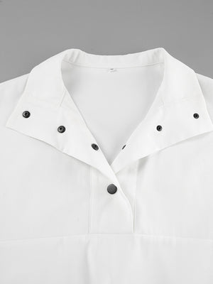 White two-piece set with snap details and a collared neckline.