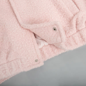 Textured blush pink bouclé bomber jacket with snap closure detail