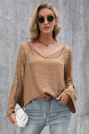 Camel lace sleeve blouse with scallop trim neckline and bell sleeves.