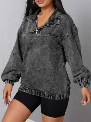Chic quarter-zip denim top in dark gray acid wash with elastic hem and cuffs.