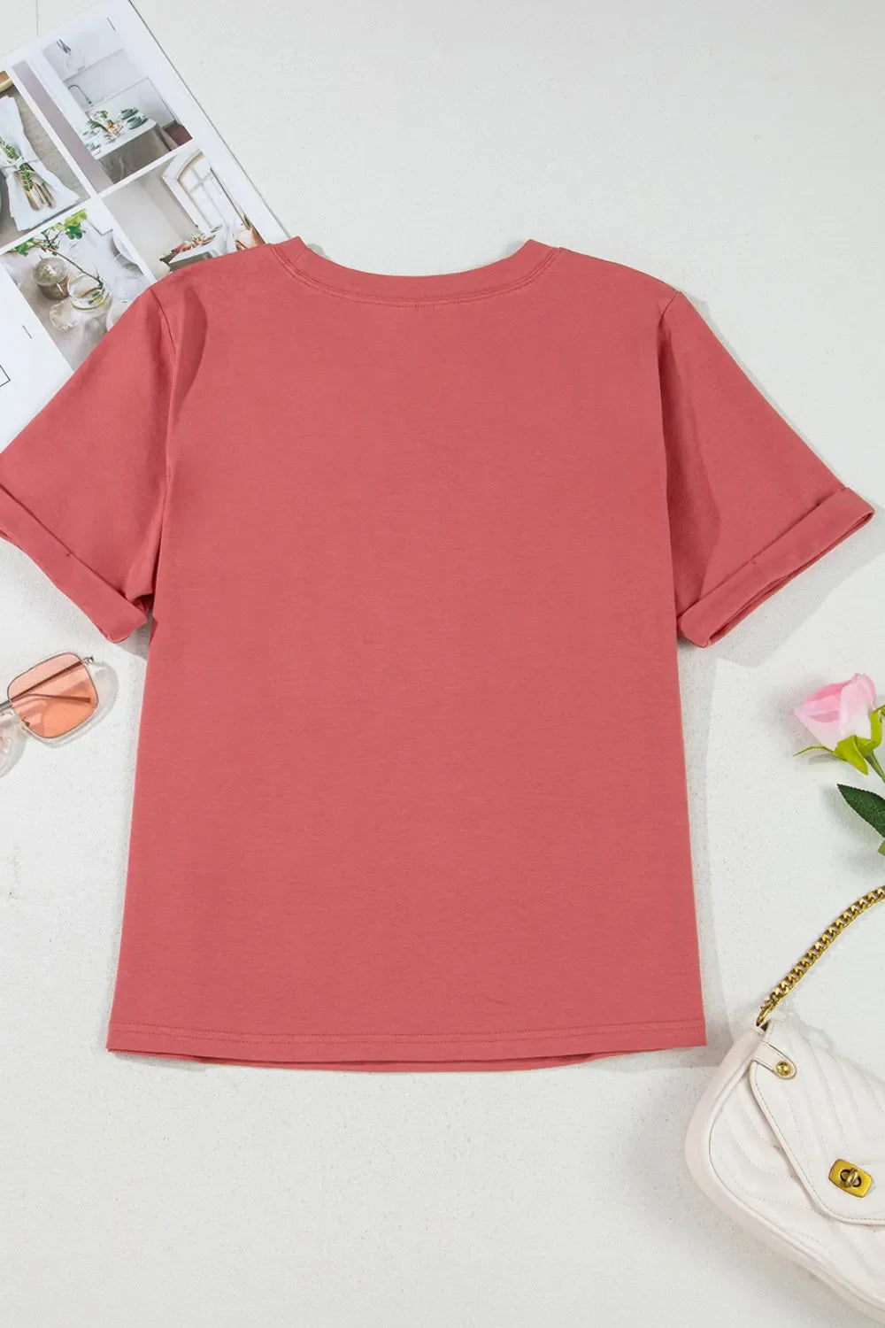 Burnt coral casual t-shirt with rolled sleeves and a crew neck.