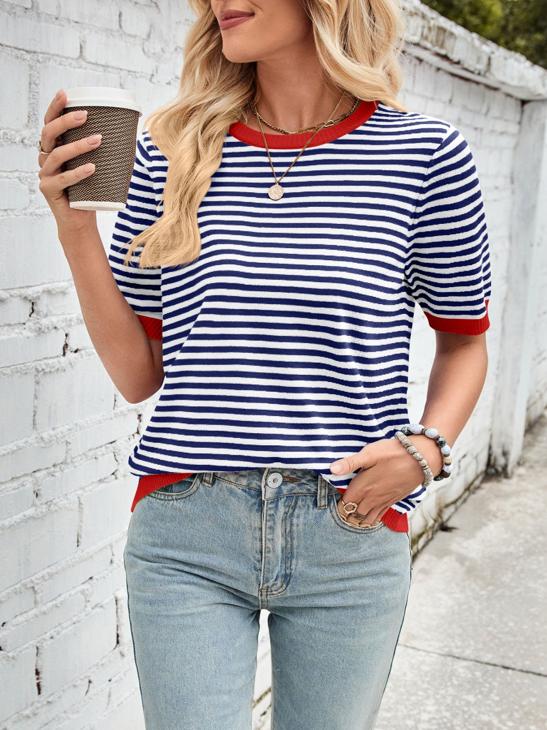 Nautical striped knit tee with red trim and short sleeves.
