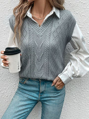 Gray diamond knit V-neck vest with openwork details, worn over a white shirt.