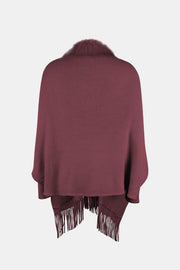 Wine faux fur trimmed fringe cape with a cozy knit texture.