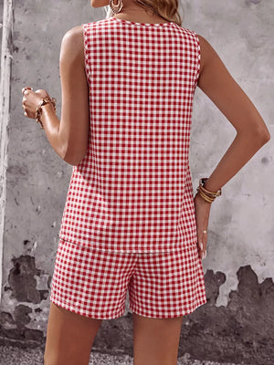 Red gingham two-piece set with sleeveless top and shorts, button details.