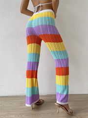 Vibrant crochet knit maternity pants with rainbow stripes and cable knit detail.