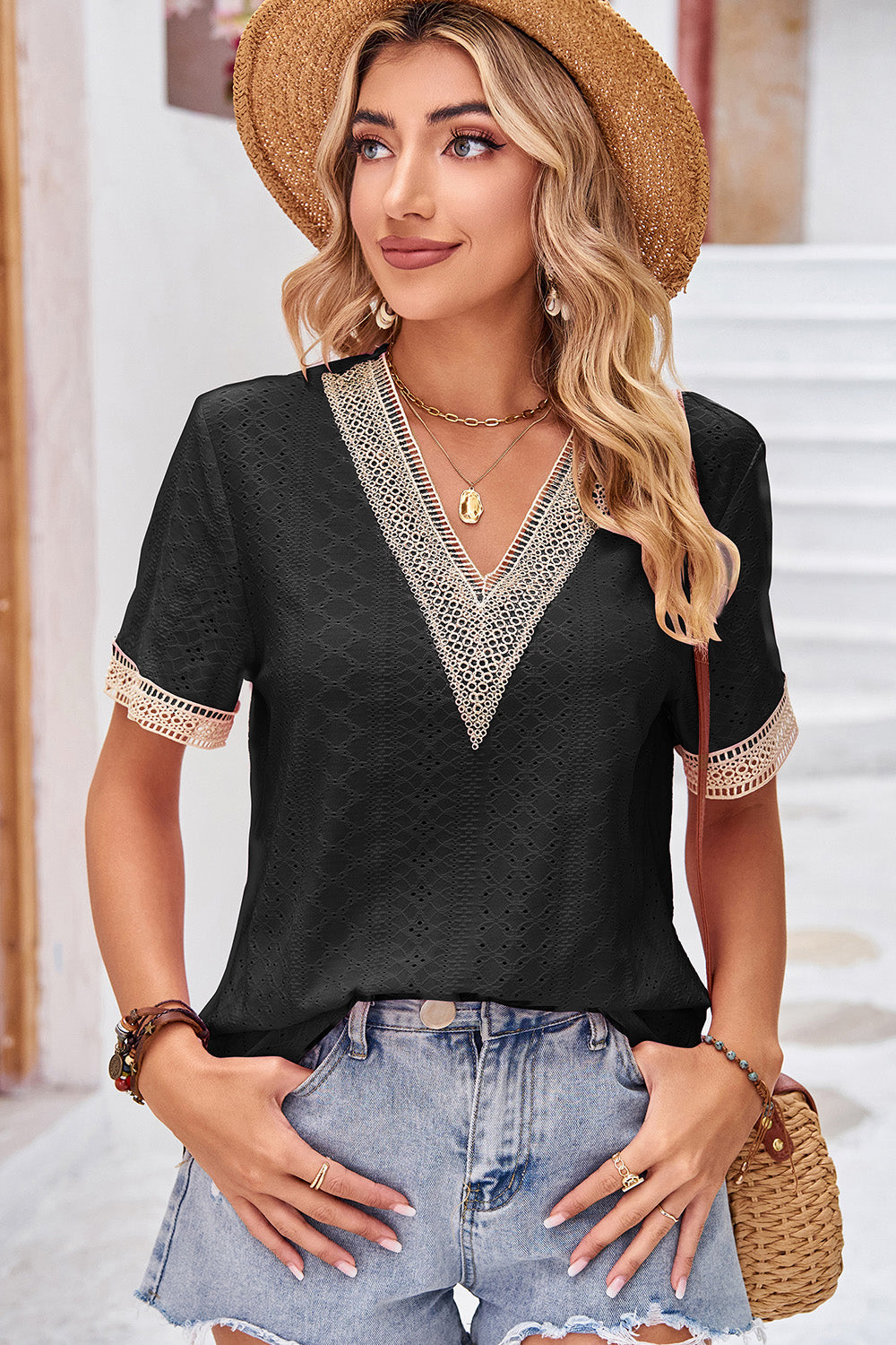 Black eyelet blouse with lace-trimmed V-neck and short sleeves