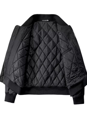 Black quilted bomber jacket with ribbed collar and cuffs