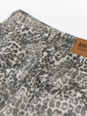 Leopard print cargo pants with utility pockets and button fly.