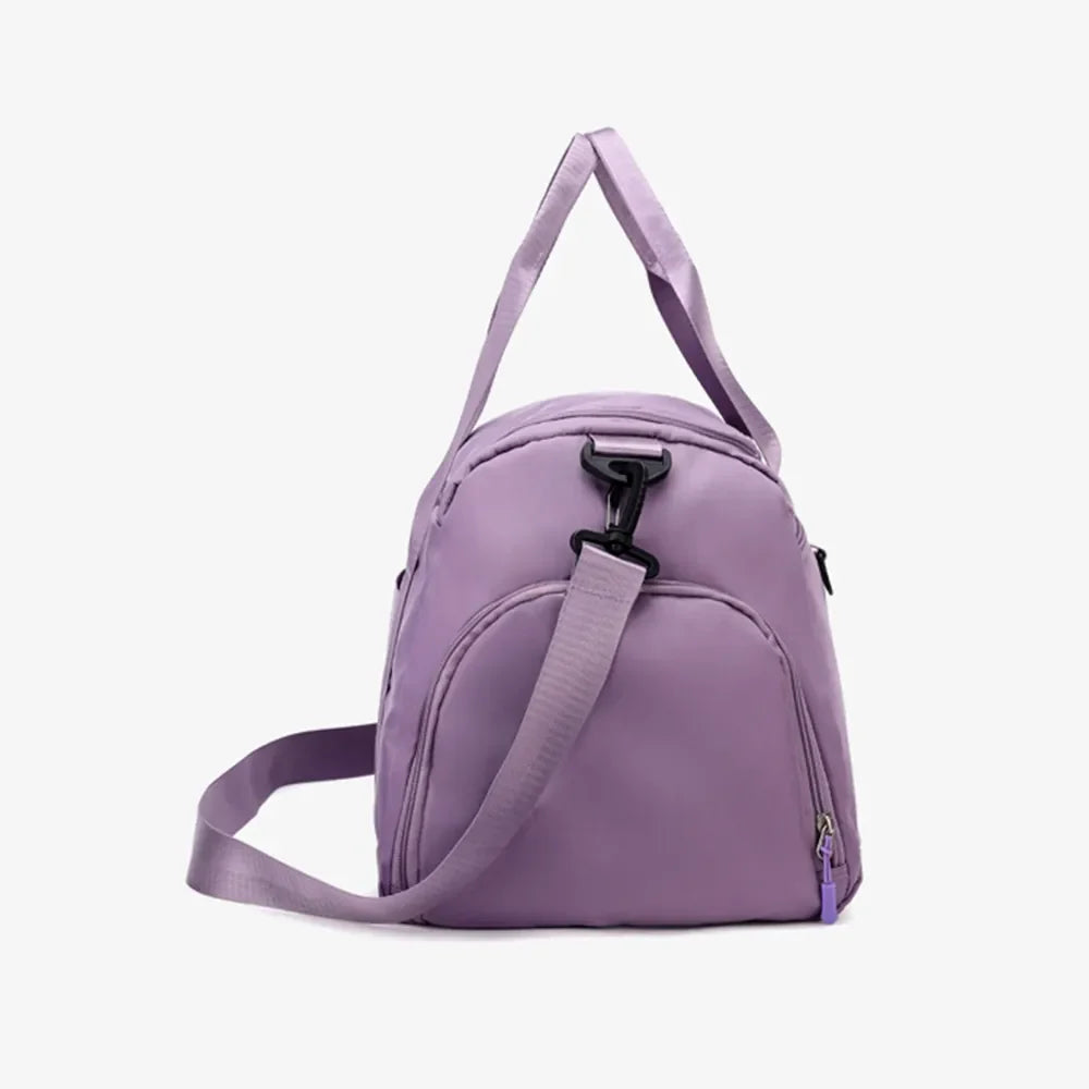 Mauve nylon duffle bag with adjustable strap and side pocket