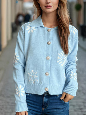 Pastel blue knit cardigan with pearl embellished snowflake pattern and button front.