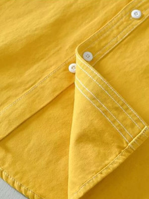 Yellow men's undershirt with contrast stitching and white buttons