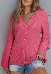 Hot pink diamond-cut sleeve knit cardigan with gold buttons and v-neck.