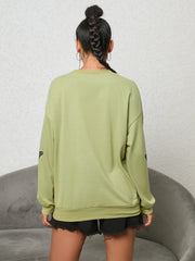 Lime oversized sweatshirt with black butterfly graphic on sleeves