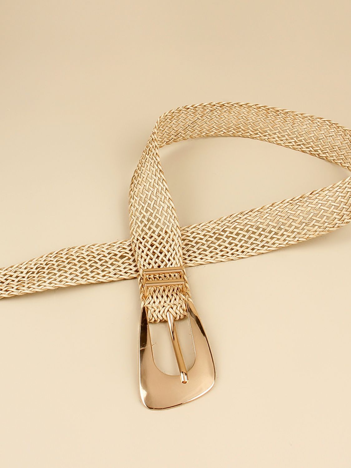 Woven raffia belt in gold with a gold-tone buckle.