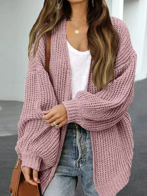 Dusty pink chunky knit cocoon cardigan with balloon sleeves and open front.