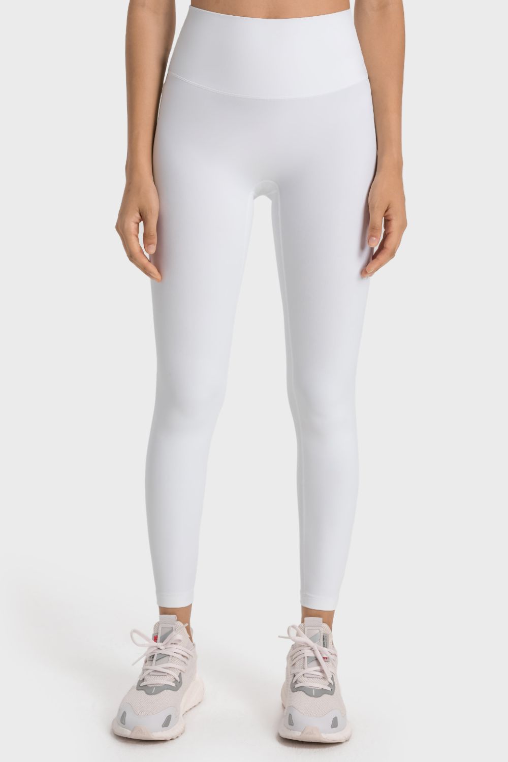 White seamless high-waist performance leggings with a smooth finish.
