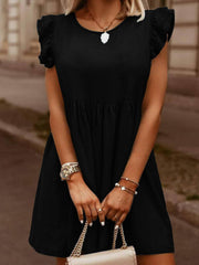 Black denim babydoll dress with ruffled short sleeves and a gathered waist.