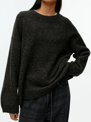 Oversized brushed knit crewneck sweater in charcoal gray with relaxed fit and dropped shoulders.