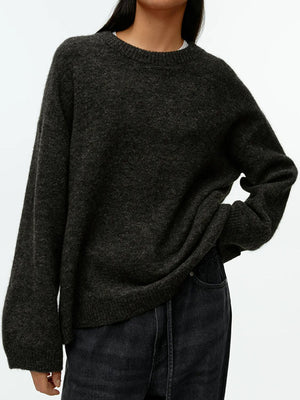 Oversized brushed knit crewneck sweater in charcoal gray with relaxed fit and dropped shoulders.