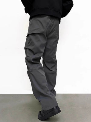 Men's gray sweatpants with multiple pockets and a relaxed fit.