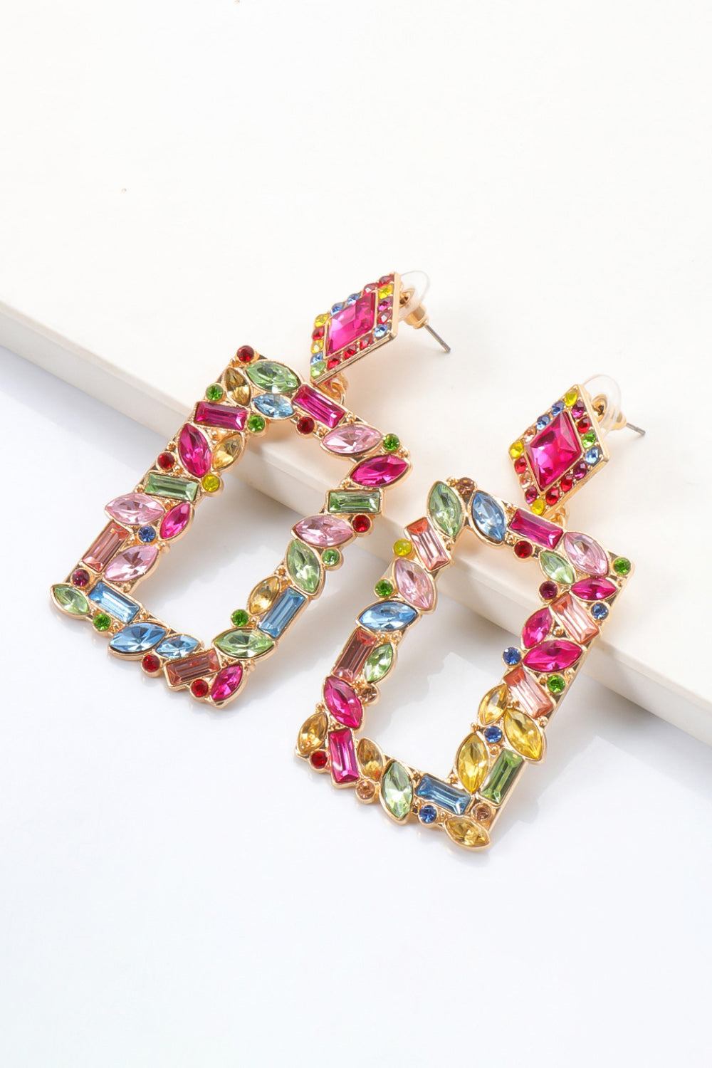 Geometric jewel box earrings with multicolor gemstones and gold alloy frame.