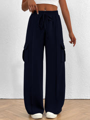 Navy high waist cargo sweatpants with drawstring and side pockets.