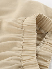 Tan cotton crop top and wide-leg pants set with ruched elastic waistband detail.