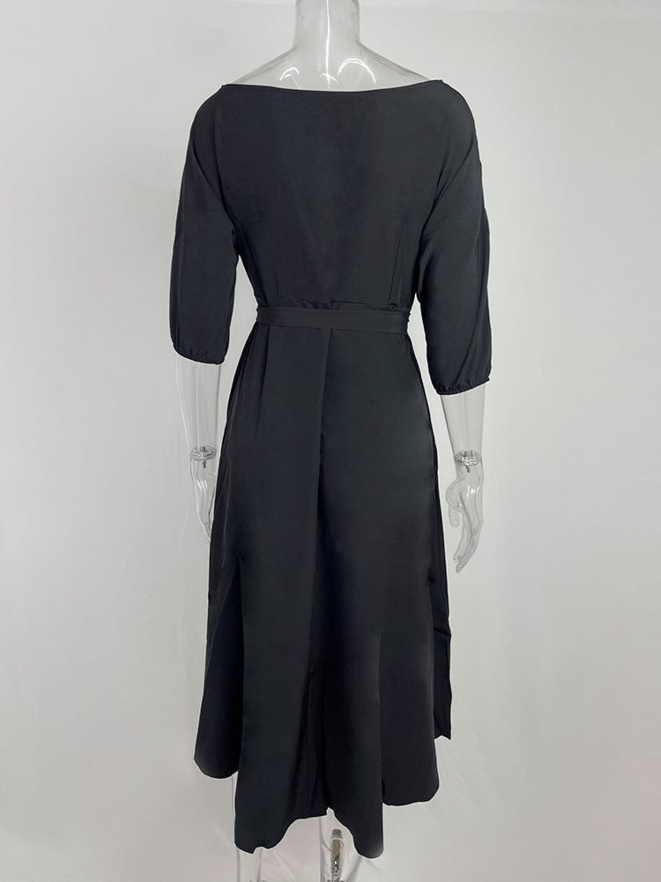 Black belted midi dress with 3/4 sleeves and a-line skirt.