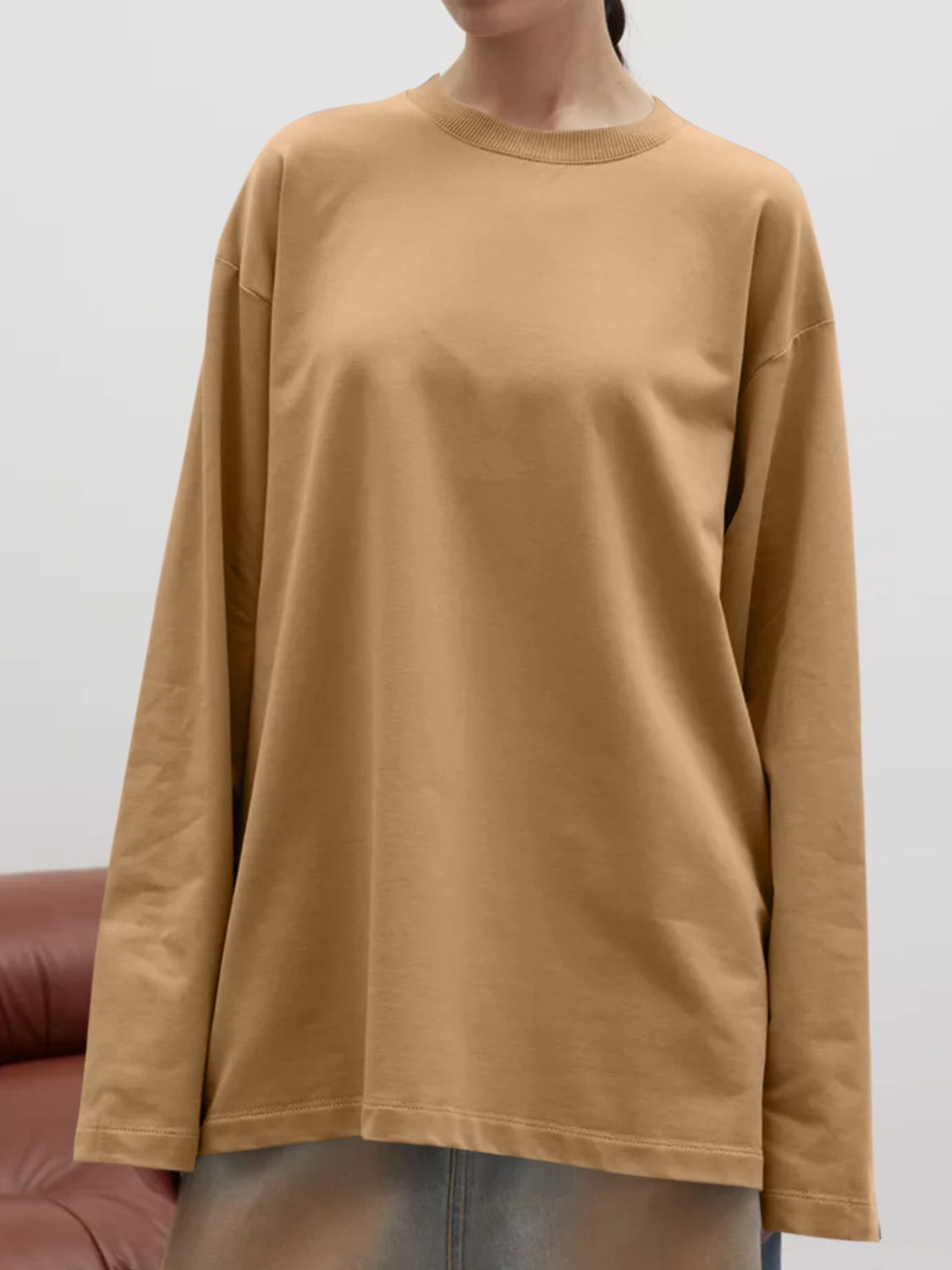 Oversized crewneck sweatshirt in tan with voluminous long sleeves and a relaxed fit.