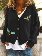 Black V-neck acrylic cardigan with bee embroidery and button-down front.