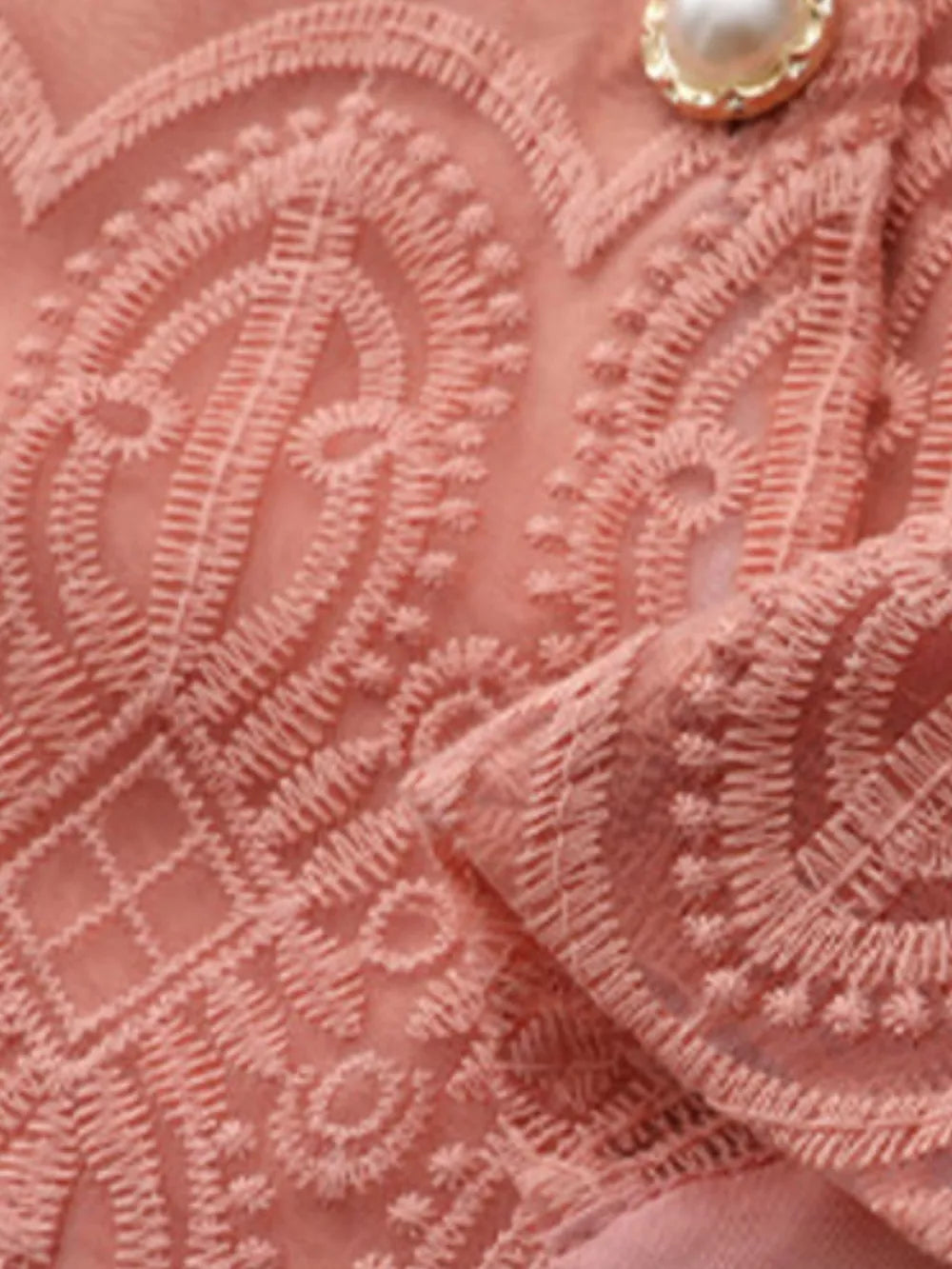 Apricot lace two-piece set with intricate embroidery and pearl button detail.
