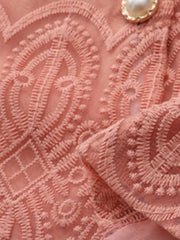 Apricot lace two-piece set with intricate embroidery and pearl button detail.