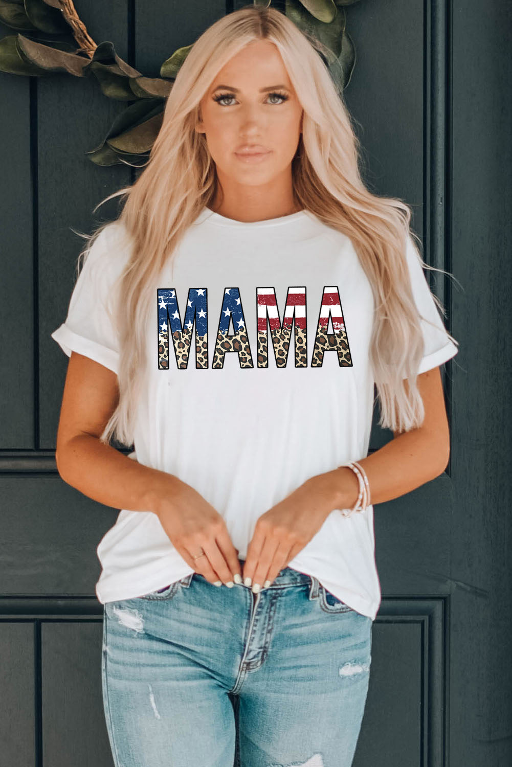White cotton blend graphic tee with patriotic "Mama" print and leopard accents.