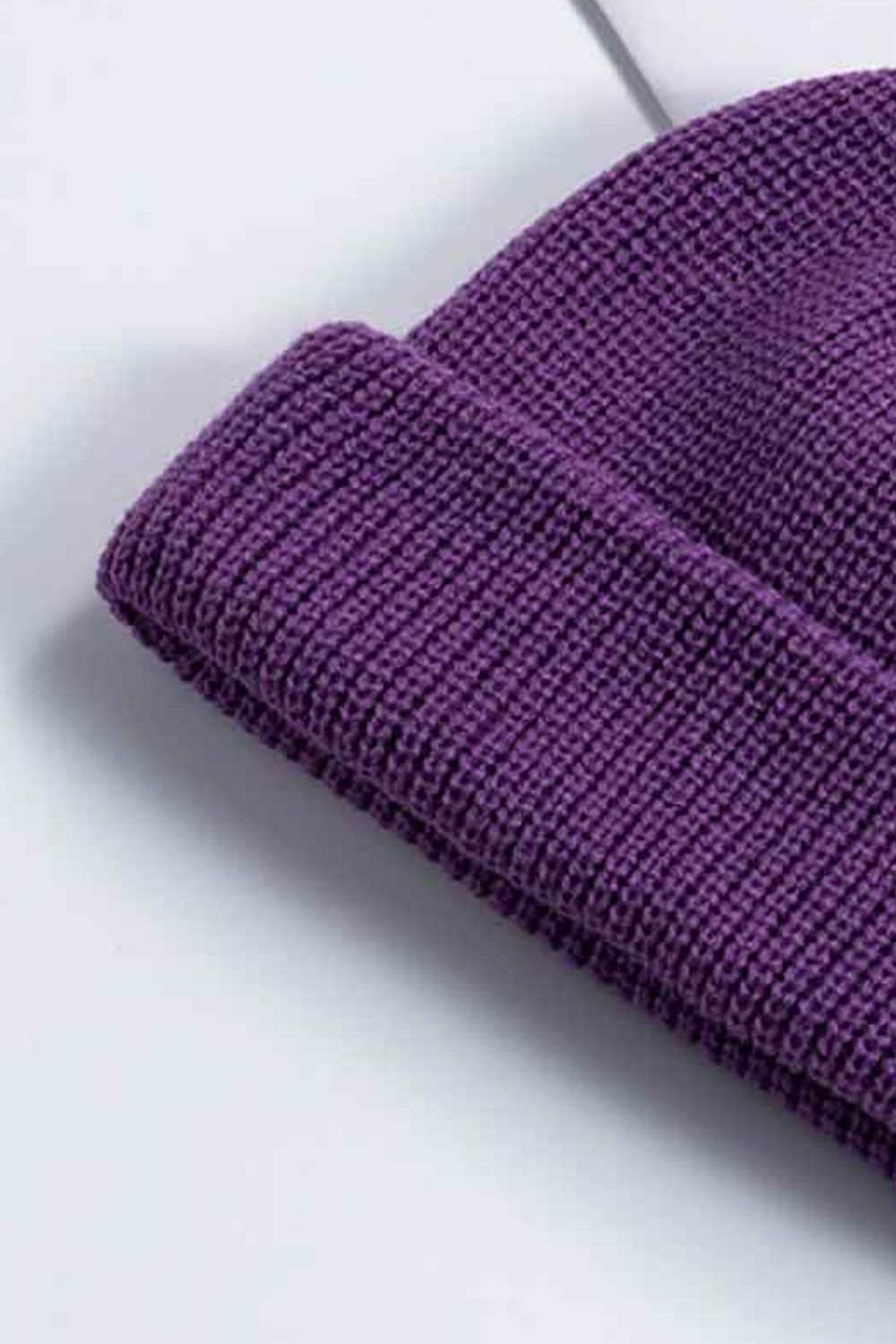 Purple ribbed knit beanie with a turn-up cuff