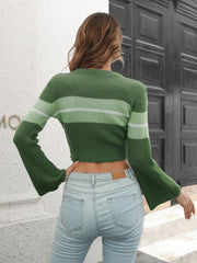 Cropped knit sweater in army green with horizontal stripes and flared sleeves.