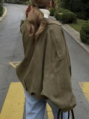 Oversized military green zip-up jacket with a relaxed fit and dropped shoulders.